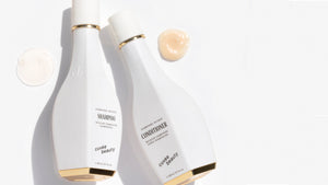 Bottles of Cuvee Shampoo and Conditioner, with product swatches. Shampoo is semi-transparent and fluid, conditioner is peachy and viscous.